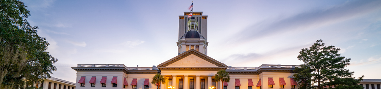 The Florida State Capitol illuminated at dusk.