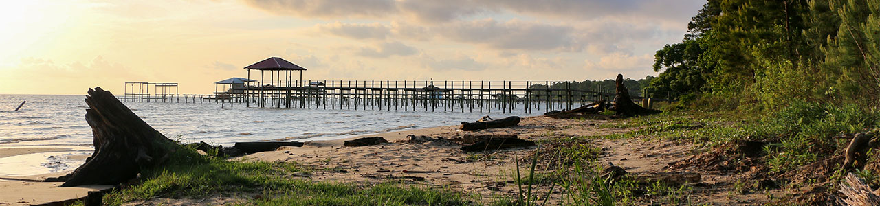 A coastal dock on an Alabama beach.