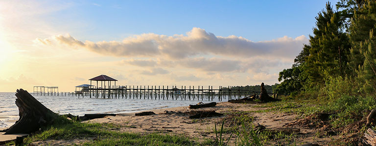 A coastal pier on an Alabama beach.