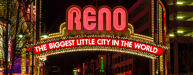 A billboard reads, "Reno, the biggest little city in the world."