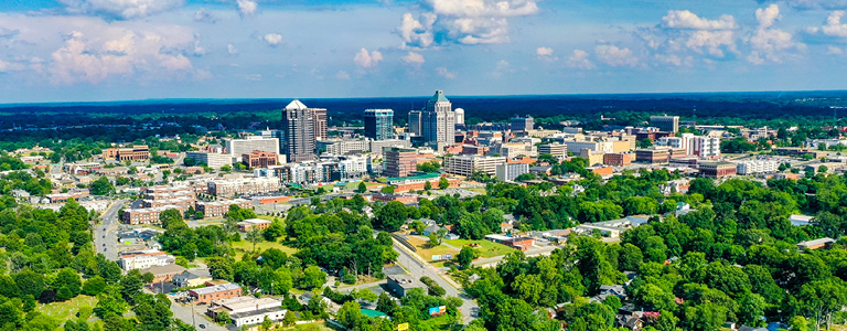 The downtown Greensboro skyline on a sunny day.