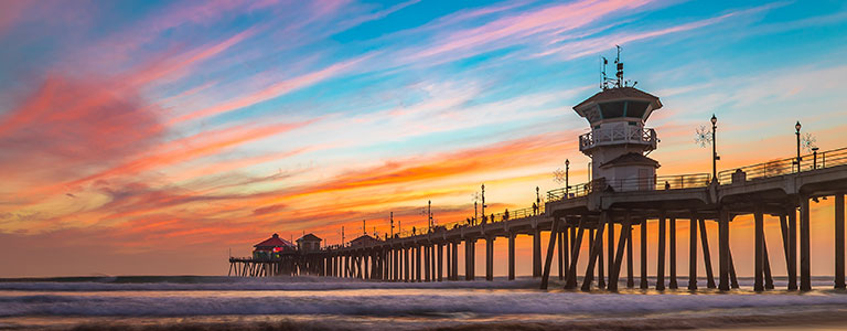 A view of a pier on the California coast.